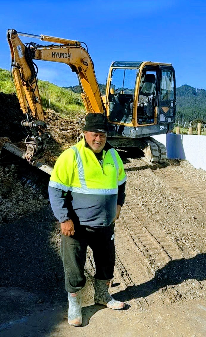 Ron Heta, Founder and Principal Contractor of Hetaz Contractorz, on site with excavator